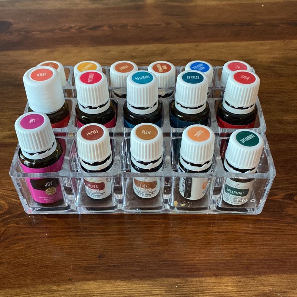 Young Living Oils; partially used. PLUS storage shelf